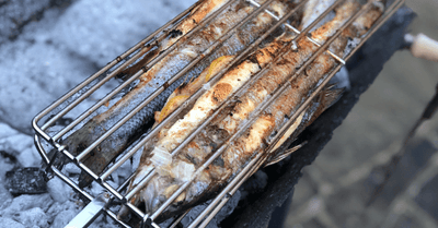 Whole Sea Bass cooked over charcoal on a Cyprus BBQ